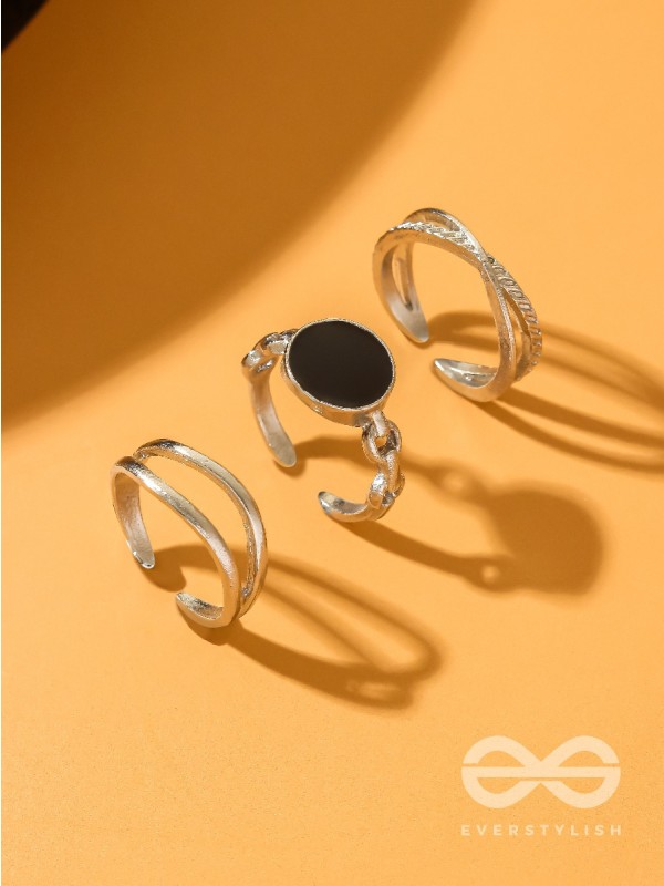  THREE-WAY- SET OF THREE BLACK AND SILVER RINGS