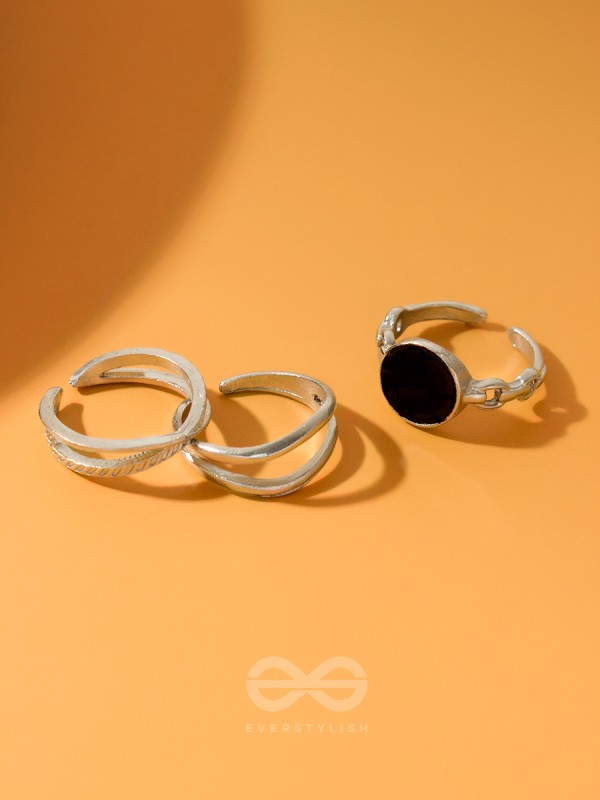  THREE-WAY- SET OF THREE BLACK AND SILVER RINGS