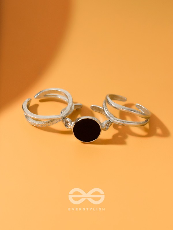  THREE-WAY- SET OF THREE BLACK AND SILVER RINGS