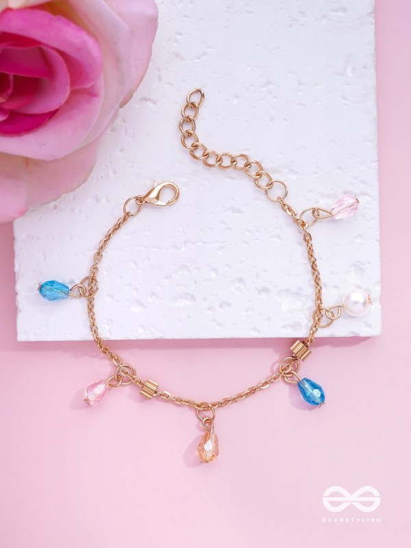 The Shimmering Sleet- Pearl and Crystals Studded Golden Bracelet