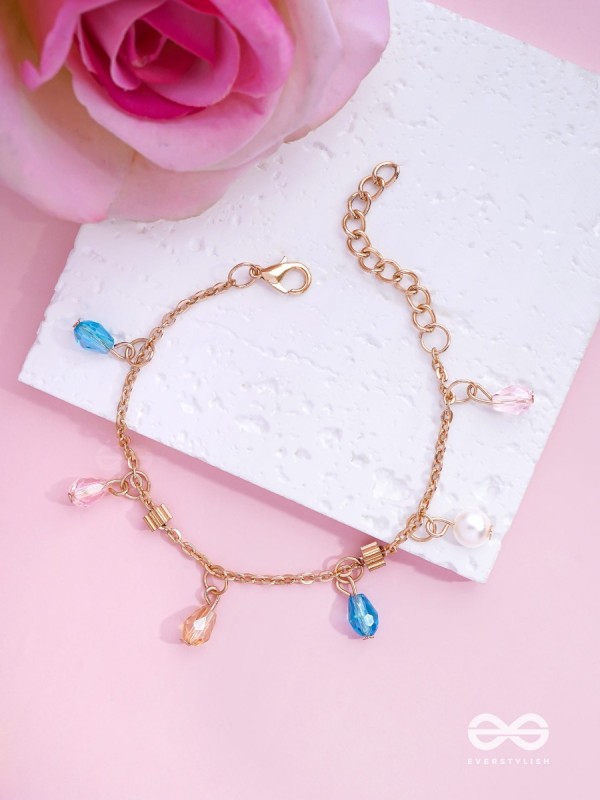 The Shimmering Sleet- Pearl and Crystals Studded Golden Bracelet