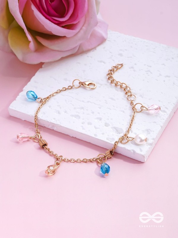 The Shimmering Sleet- Pearl and Crystals Studded Golden Bracelet