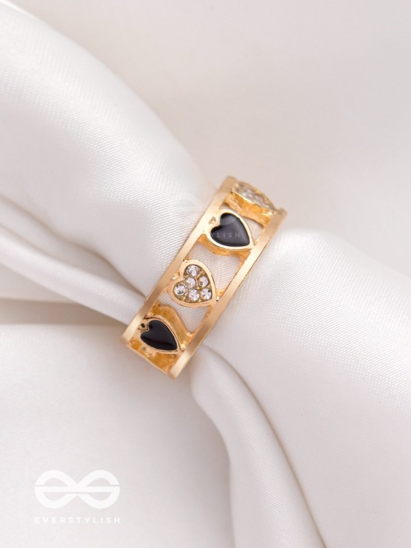 ENVELOPED IN HEARTS - GOLDEN STATEMENT RING (BLACK)
