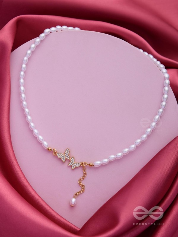 TWO TINY AVIATORS - GOLDEN PEARL NECKPIECE