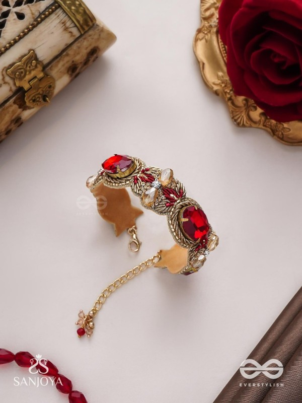 Sundarasūra- Beautiful Wine- Bracelet with rich hue of the red stones and twisted thread work.