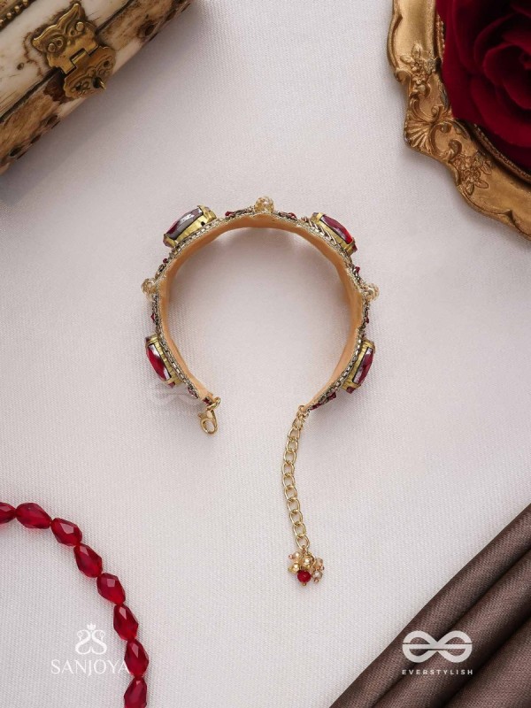 Sundarasūra- Beautiful Wine- Bracelet with rich hue of the red stones and twisted thread work.