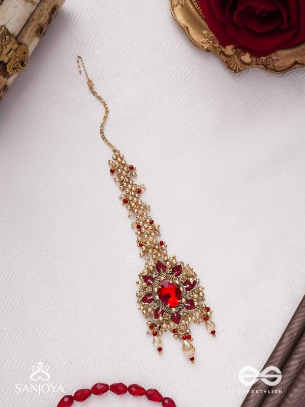 Kumudinikunda-Delicate lotus-Embroidered hair accessory with a red stone & golden embellishments