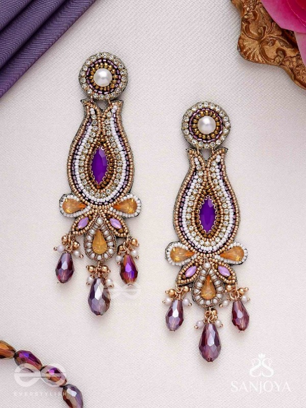 Divyaśhobhanā-Divine Splendour-Lotus-inspired embroidered design, adorned with purple and golden gem-studded motifs, Pearl and Beads.