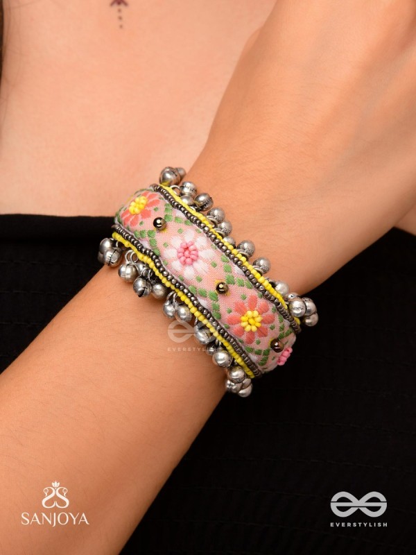 SUMANALEKHA-FLORAL PATTERN- SEMI-OXIDIZED BRACELET FEATURES GHUNGROO, BEADS, AND EMBROIDERED FLOWERS