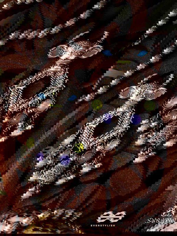 NANDI MANIKARNA- NANDI STONE EARRINGS-OXIDIZED EARRINGS FEATURING A BULL FACE, ADORNED WITH STONES AND GHUNGHROOS