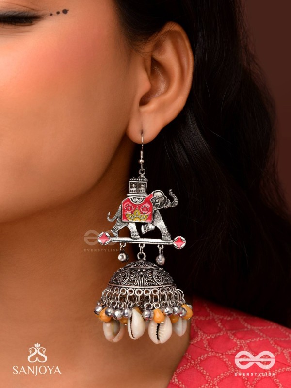 GAJASANKHA KARṆIKA- ELEPHANT-SHELL EARRINGS- OXIDIZED EARRINGS FEATURING AN ELEGANT MOTIF, DELICATE GHUNGHROO'S, AND COWRIE SHELLS