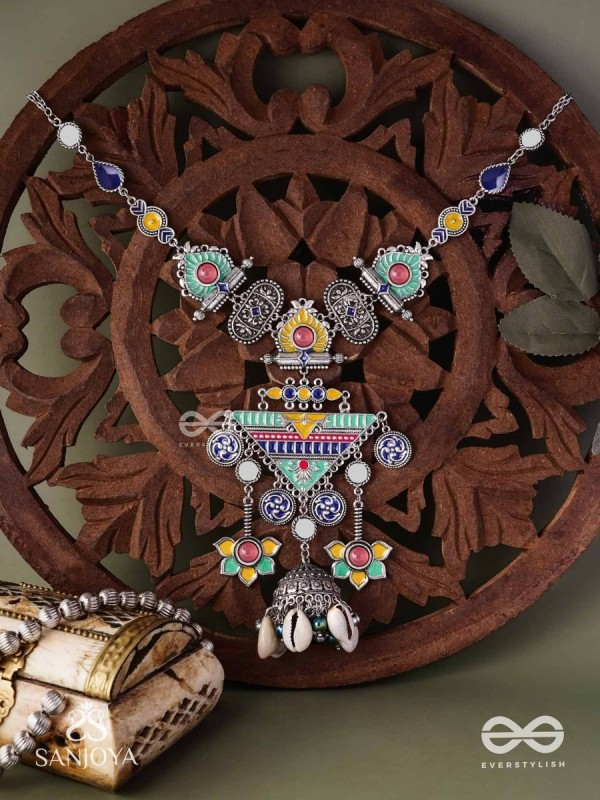 Rangapadma-Color bloom- Enamelled Neckpiece with cowrie shells,mirror and colorful gemstones on oxidized metalwork.