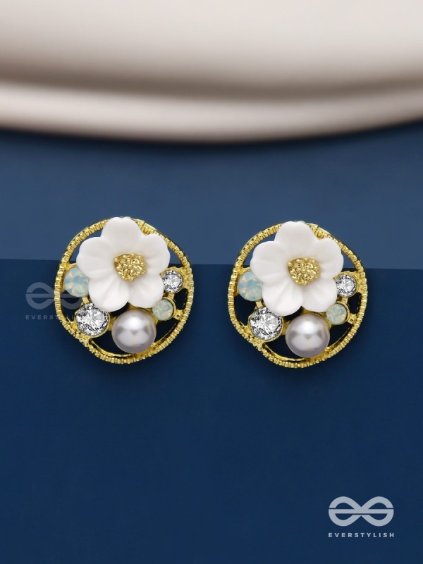 Divine temptation- white floral studs encircled with golden mesh 