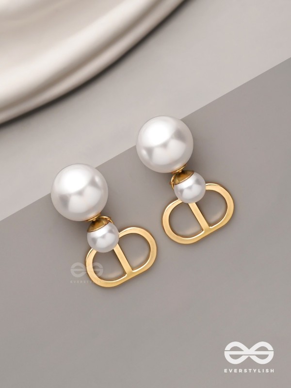 Starlit orb- dangling pearl earrings with golden spheres 
