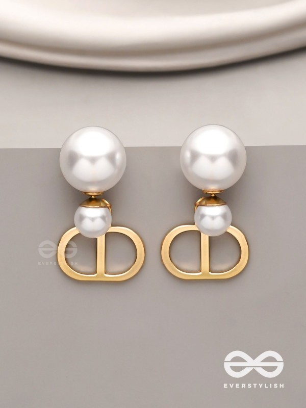 Starlit orb- dangling pearl earrings with golden spheres 