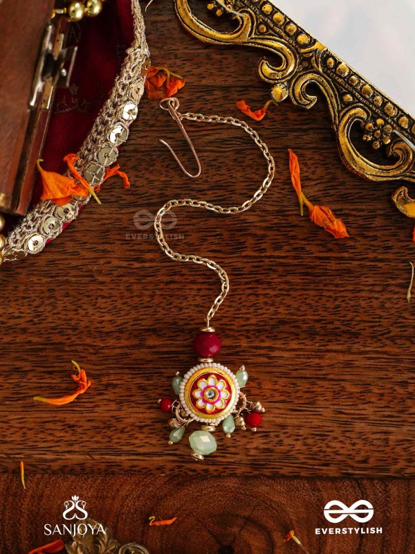 SHONAPRABHA- RADIANCE OF GOLD AND RED- HANDCRAFTED KUNDANMAANGTIKA  WITH GOLDEN MOONS AND RED BEADS