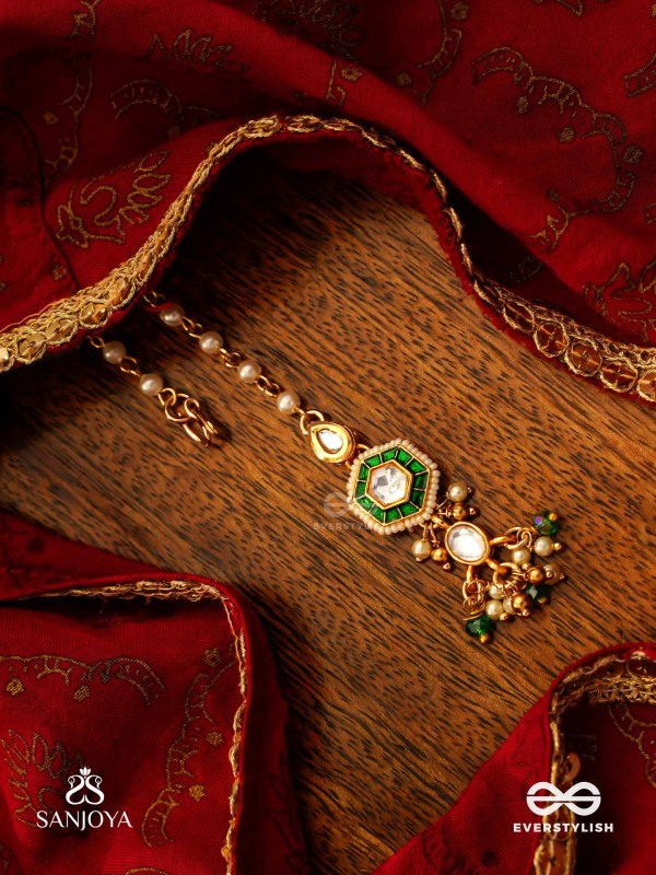 JALNIDHI - OCEAN’S TREASURE - HANDCRAFTED KUNDAN MAANGTIKA WITH GREEN GEMSTONES AND GOLDEN DETAILS