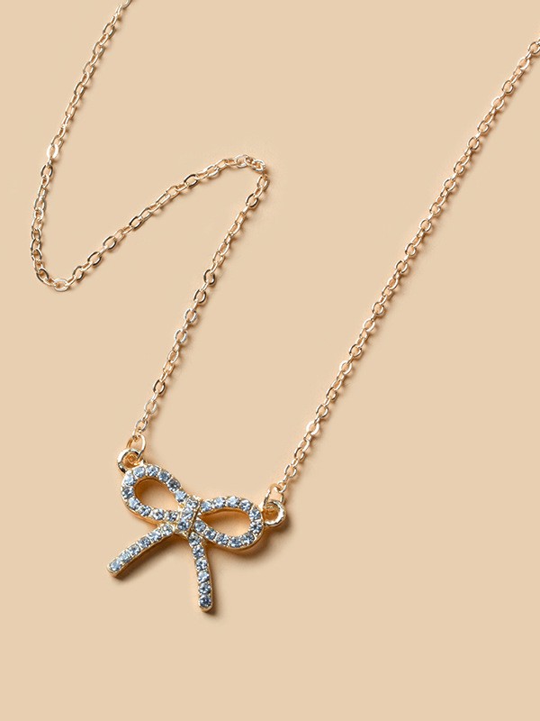 TIED IN GOLD- MINIMALIST BOW NECKPIECE