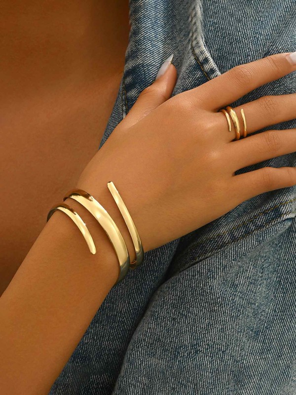 AURIC SWIRL - CONTEMPORARY GOLDEN TWIST RING+ TWISTED GLEAM- SLEEK AND POLISHED METALLIC CUFF BRACELET