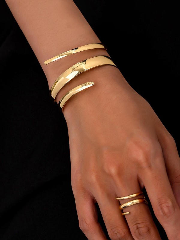 AURIC SWIRL - CONTEMPORARY GOLDEN TWIST RING+ TWISTED GLEAM- SLEEK AND POLISHED METALLIC CUFF BRACELET