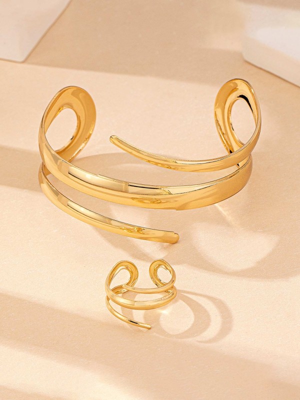 AURIC SWIRL - CONTEMPORARY GOLDEN TWIST RING+ TWISTED GLEAM- SLEEK AND POLISHED METALLIC CUFF BRACELET