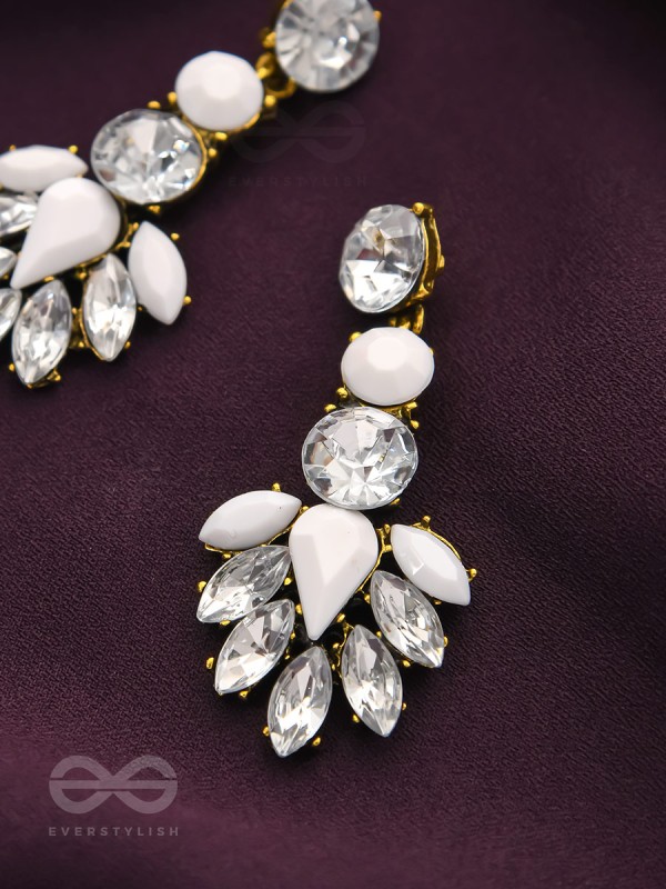 The pious touch white enigmatic stones studded earrings 