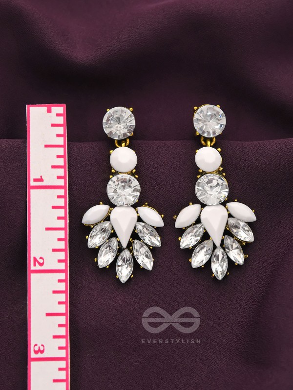 The pious touch white enigmatic stones studded earrings 