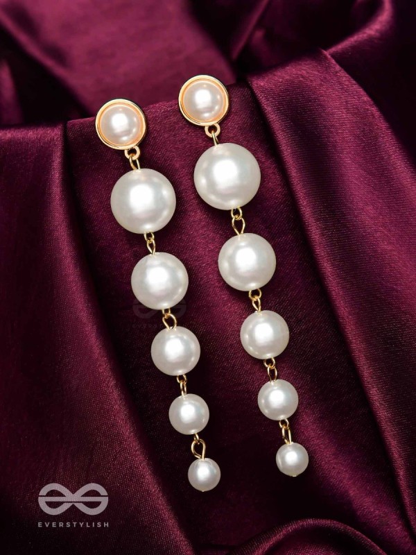 Elegance is a deadly weapon- white pearls statement earrings