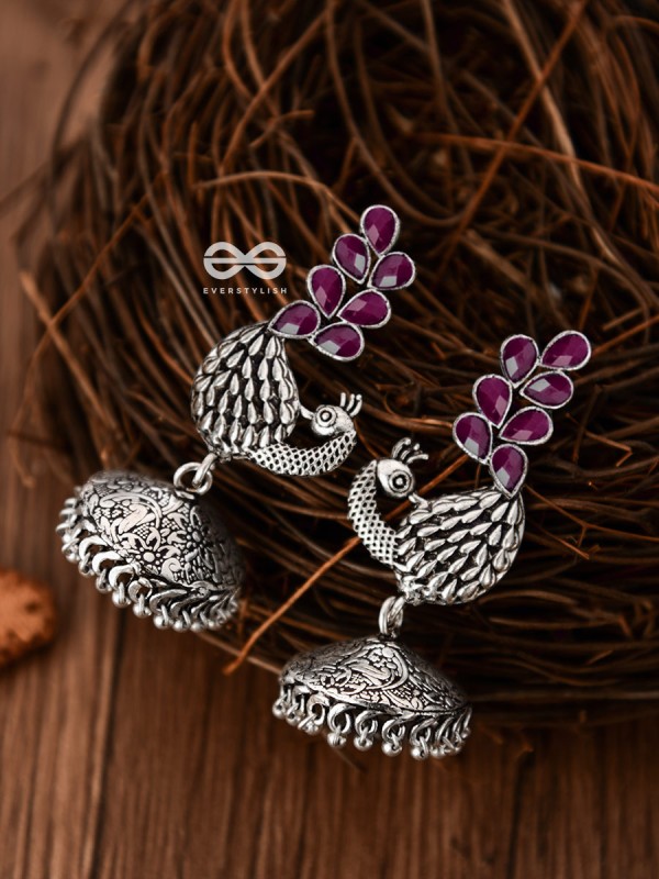The Dancing Peacocks Engraved Jhumkis (Ruby Red) - Embellished Oxidised Collection