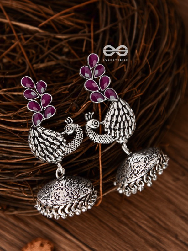The Dancing Peacocks Engraved Jhumkis (Ruby Red) - Embellished Oxidised Collection