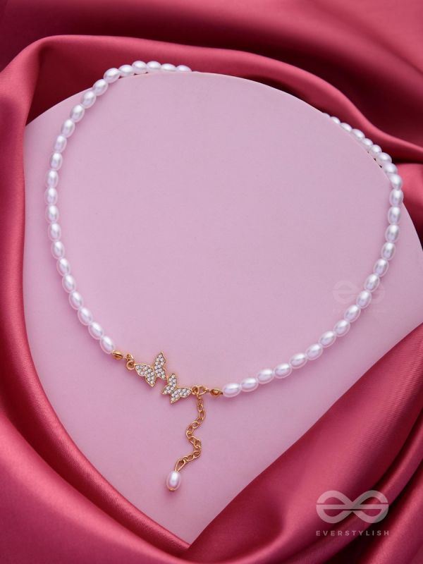 TWO TINY AVIATORS - GOLDEN PEARL NECKPIECE