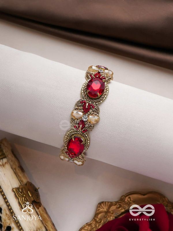 Sundarasūra- Beautiful Wine- Bracelet with rich hue of the red stones and twisted thread work.
