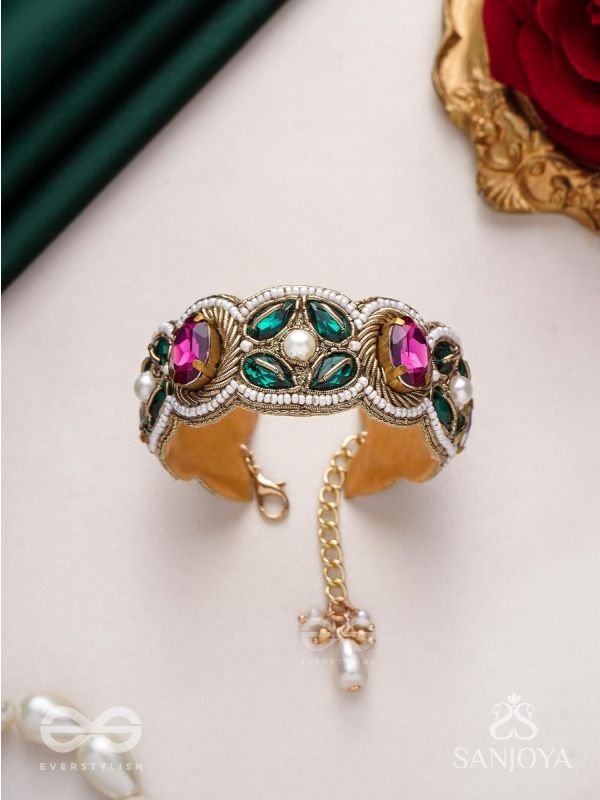 Tarangini-Wavy beauty-opulent bracelet embedded with purple and green stones