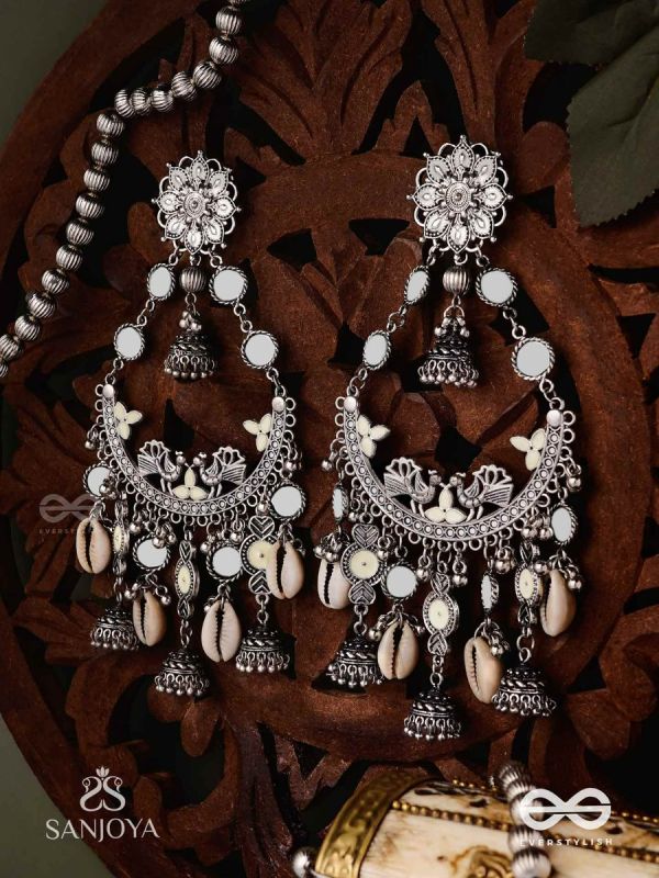 CHANDRAMAYURA- MOON-PEACOCK EARRINGS- OXIDIZED CHAANDBAALI EARRINGS, ADORNED WITH MIRRORS, GHUNGHROOS, COWRIE SHELLS, AND DANGLING JHUMKA