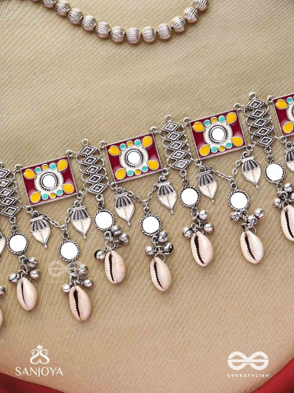  SANGRAHITAVARNA- COLLECTED HUES- ENAMELLED OXIDIZED CHOKER NECKPIECE IN PASTEL HUES WITH COWRIE SHELLS, GHUNGROOS AND MIRRORWORK