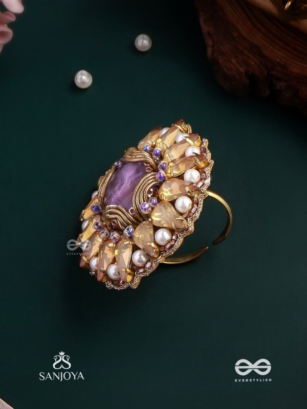 KANAKA PUSHPA – GOLDEN FLOWER EMBROIDERED FLOWER-SHAPED RING ADORNED WITH YELLOW GEMS AND PEARLS, GIVING A GOLDEN GLOW
