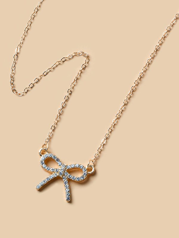 TIED IN GOLD- MINIMALIST BOW NECKPIECE