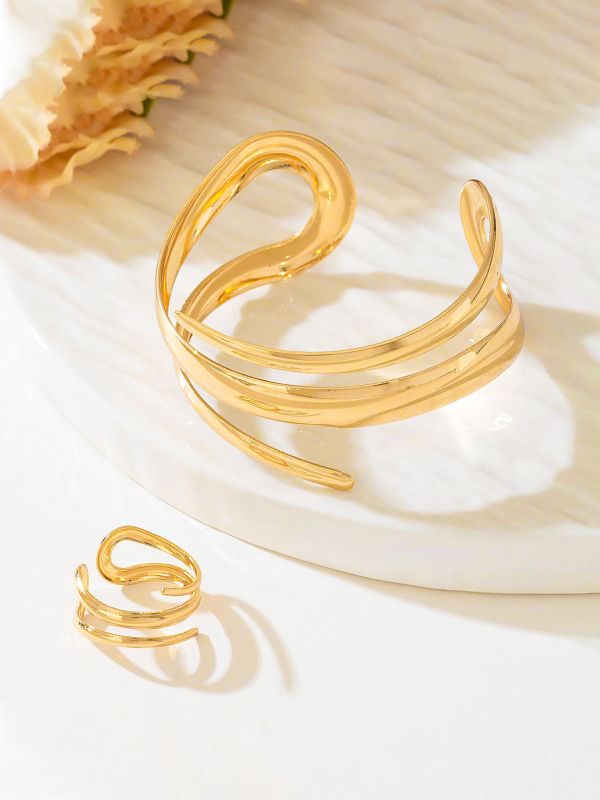 AURIC SWIRL - CONTEMPORARY GOLDEN TWIST RING+ TWISTED GLEAM- SLEEK AND POLISHED METALLIC CUFF BRACELET