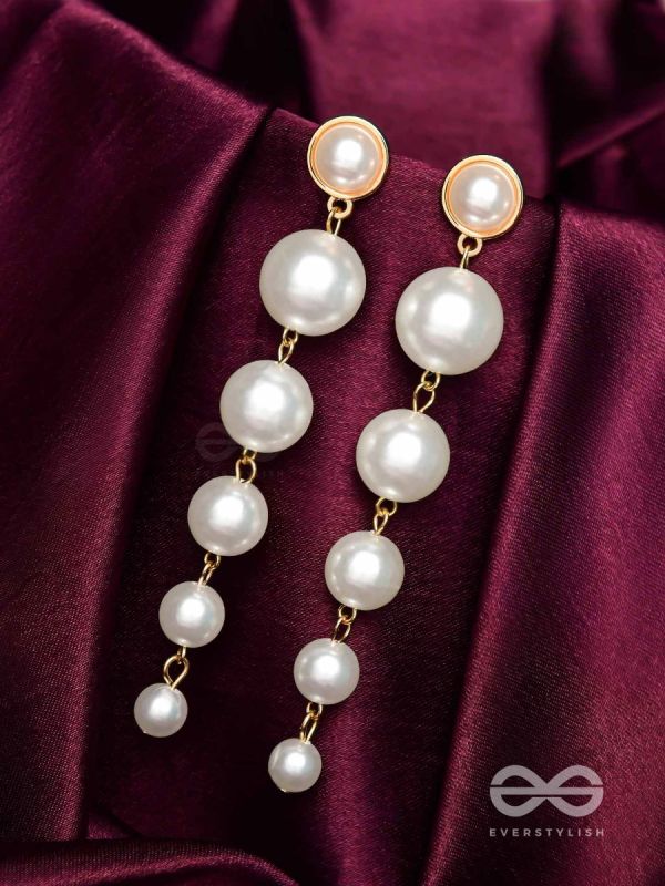Elegance is a deadly weapon- white pearls statement earrings