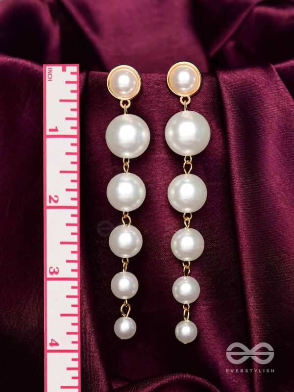 Elegance is a deadly weapon- white pearls statement earrings