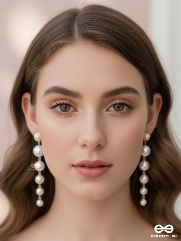 Elegance is a deadly weapon- white pearls statement earrings