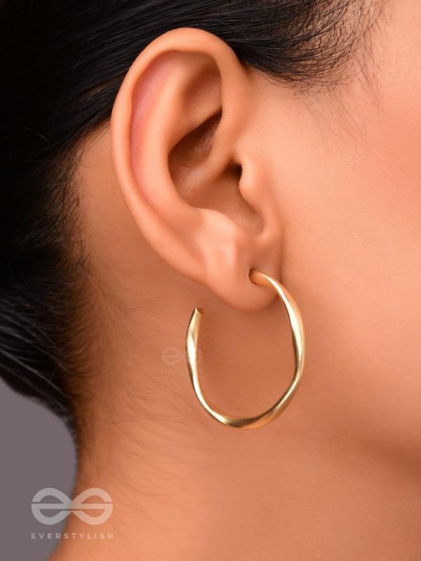 The Subtle Affirmation Golden Twists Hoop Earrings
