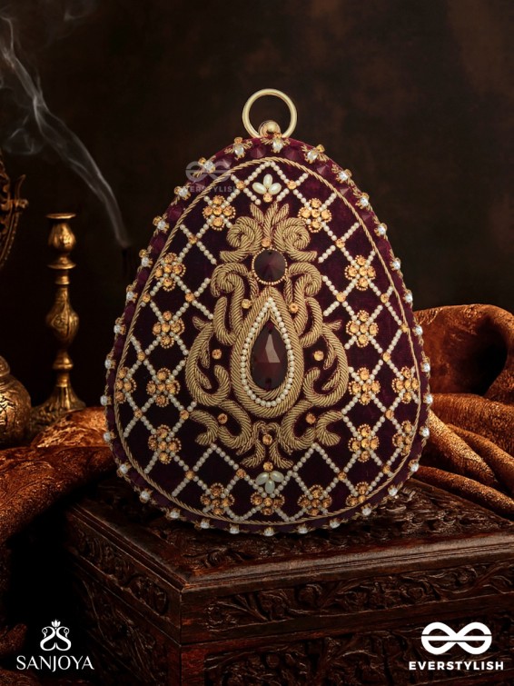 SHAHNAZ – OVAL MAROON VELVET CLUTCH WITH INTRICATE ZARDOZI EMBROIDERY AND GOLDEN METAL FRAME