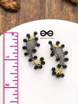 The Dual-Tone Embellished Fish Studs (Onyx Black)