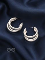 THE ELEGANT TURNS - MATTE FINISHED SILVER HOOPS