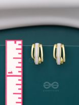 A CLASSY DAME - WHITE ENAMELLED GOLDEN STUDS