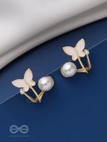 A WINGED WONDER - GOLDEN AND WHITE EAR JACKETS