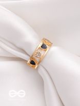 ENVELOPED IN HEARTS - GOLDEN STATEMENT RING (BLACK)