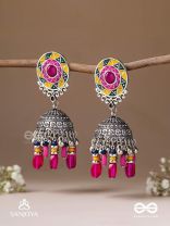 Suryaruchi-Sun's Radiance-Lavish pink earrings enamelled with a sun motif and oxidized jhumka adorned with beads and ghunghroos