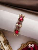 Sundarasūra- Beautiful Wine- Bracelet with rich hue of the red stones and twisted thread work.